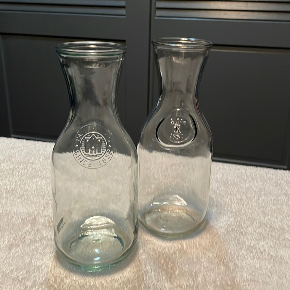 Two Vintage Paul Masson glass bottles.